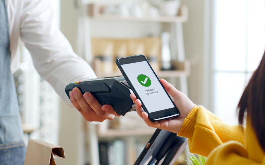 Mobile contactless payment completed via payment terminal.